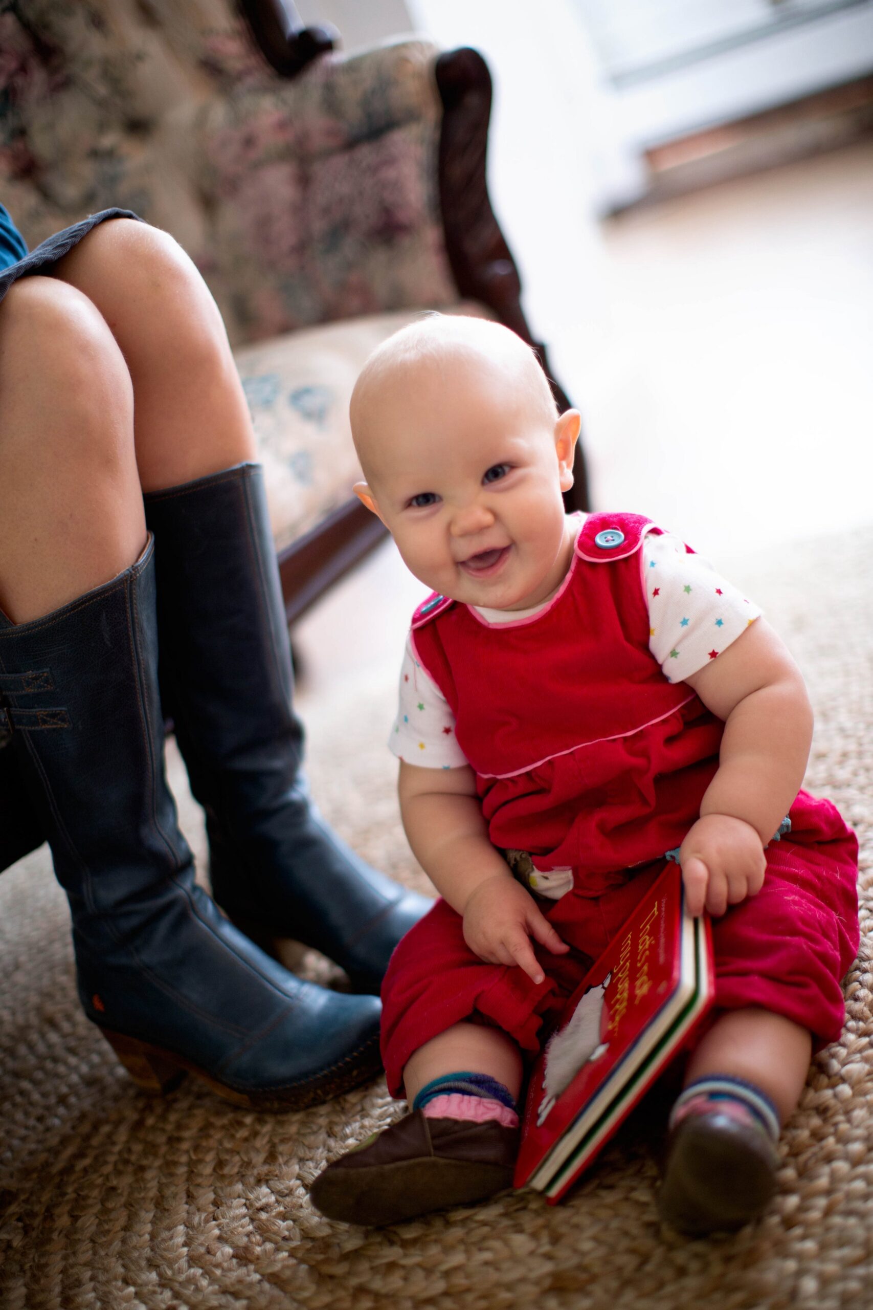 Pia baby in red overalls